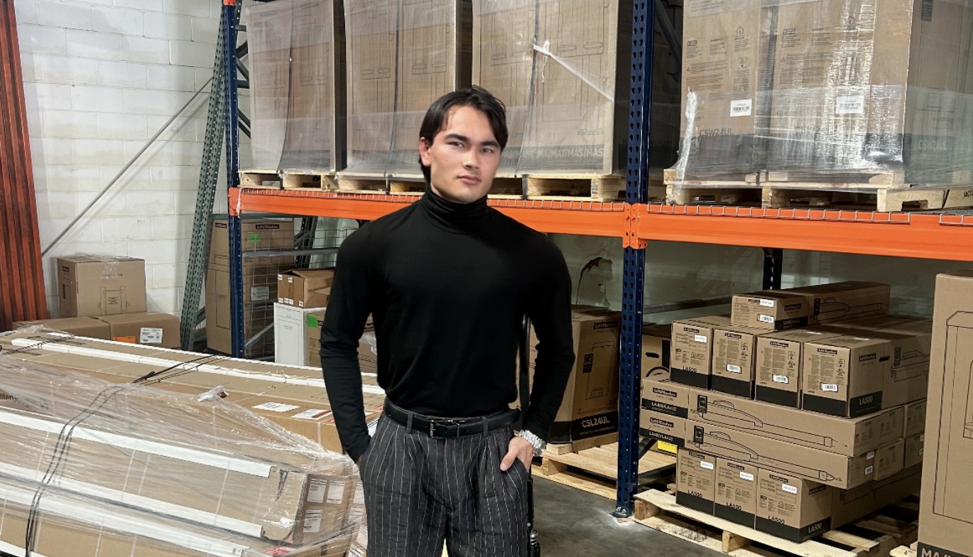 Logan Delos Santos standing in the DSE warehouse